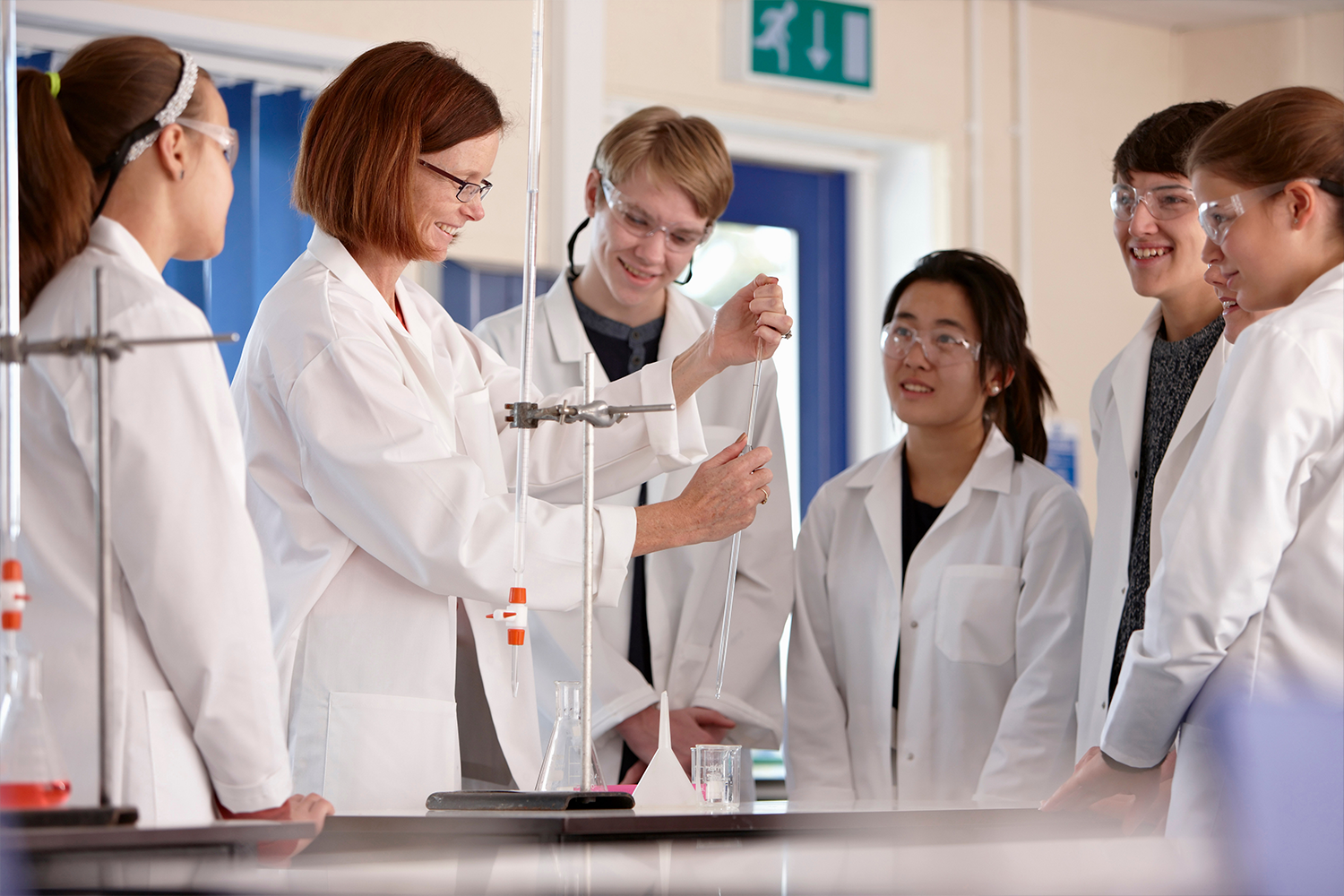 People in white coats observing something